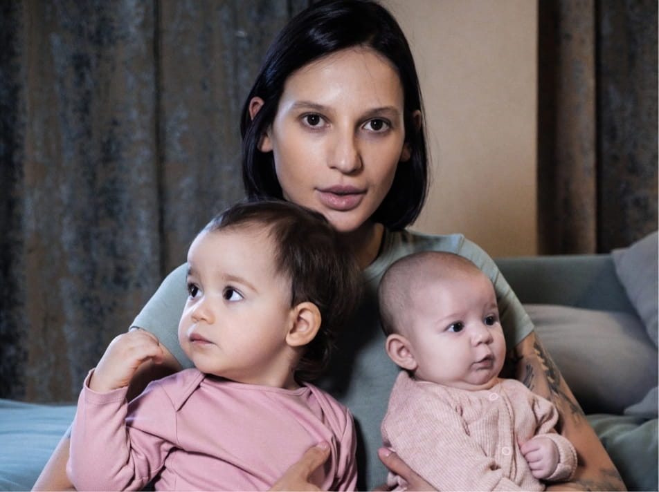A mother and two young children